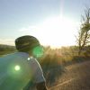 The rising sun eclipses over Abner's helmet.