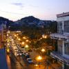 Twilight in central Manzanillo. Madly chirping black crows crowd the balconies, trees and overhead cables.