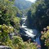 A river with several waterfalls in a spectacular gorge. Further ahead there are pools safe to swim in.